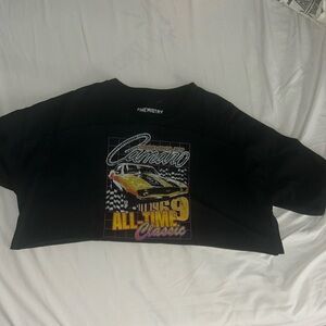 cropped t-shirt , color is black and has sum different colors added, graphic tee